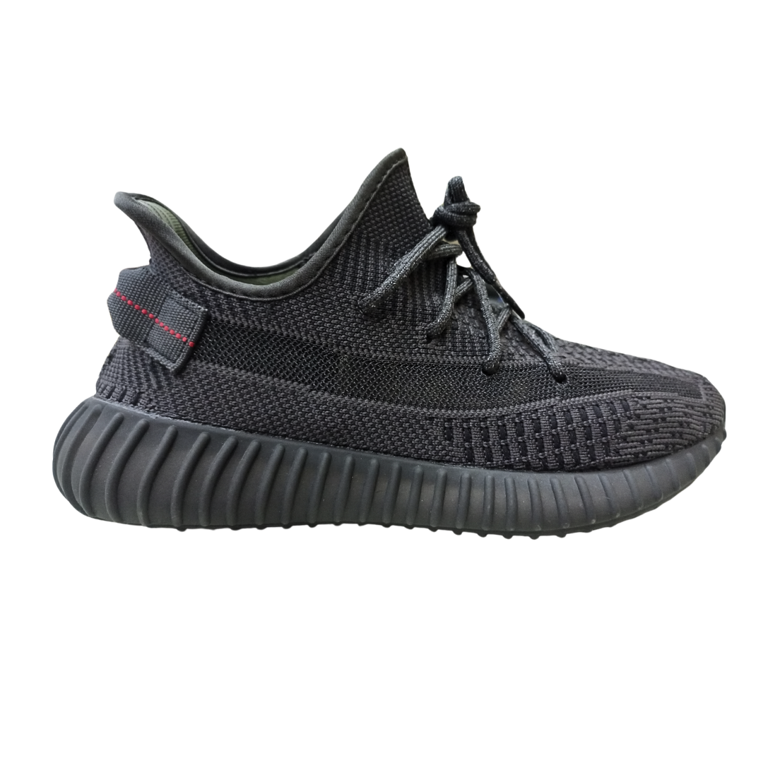 Adii Yeeezzzy 350 Triple Black sneakers right side profile displaying ergonomic midsole cushioning, neutral colorway, and modern athleisure styling.