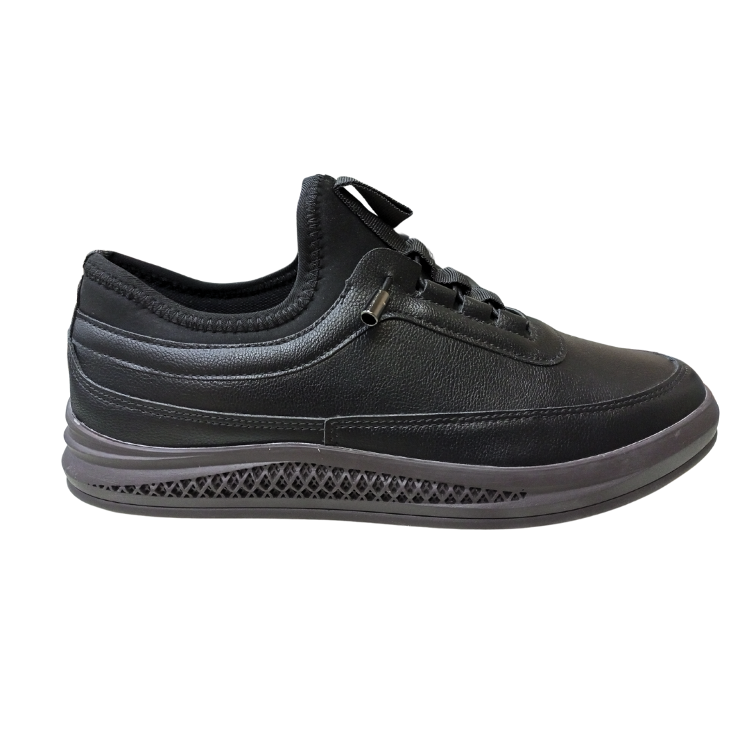 A sleek black sneaker with a modern design, featuring a breathable mesh upper and cushioned sole. Perfect for everyday wear. Available at Royaltrend.pk.